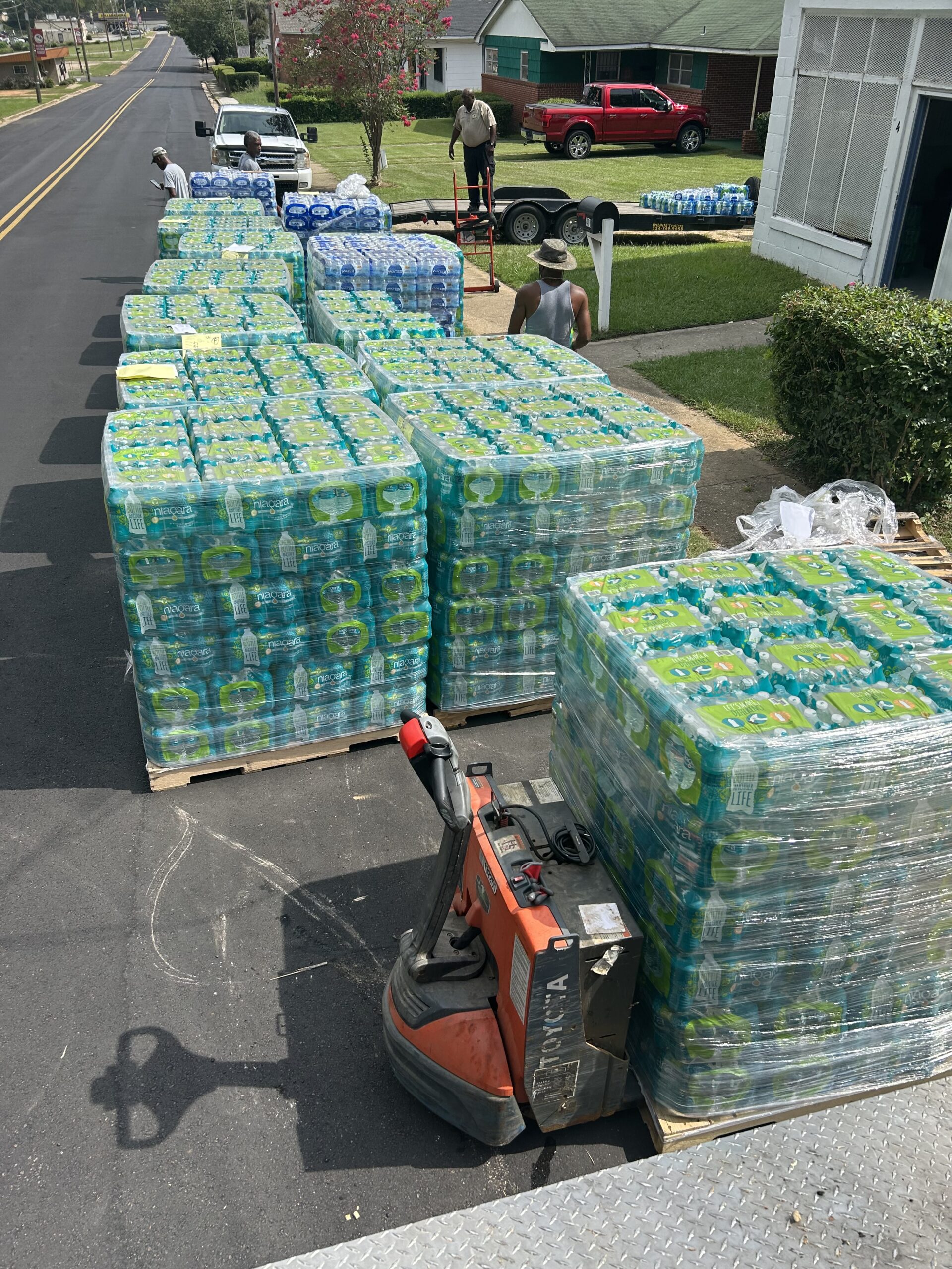 a pallets of water on a street